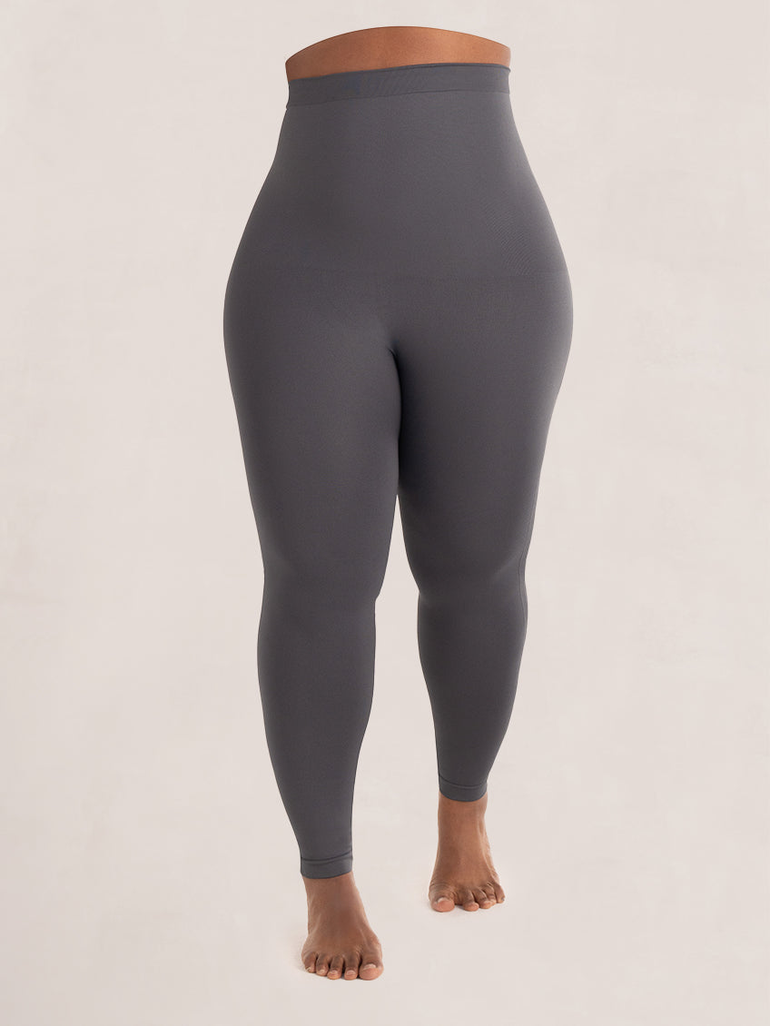 High-waisted shaping leggings side view showing firm midriff tummy compression